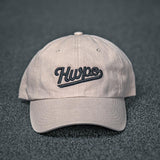 Front view of the HWPO Dad hat in Khaki