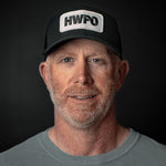 Front view of Matt O'Keefe wearing the HWPO Trucker Hat