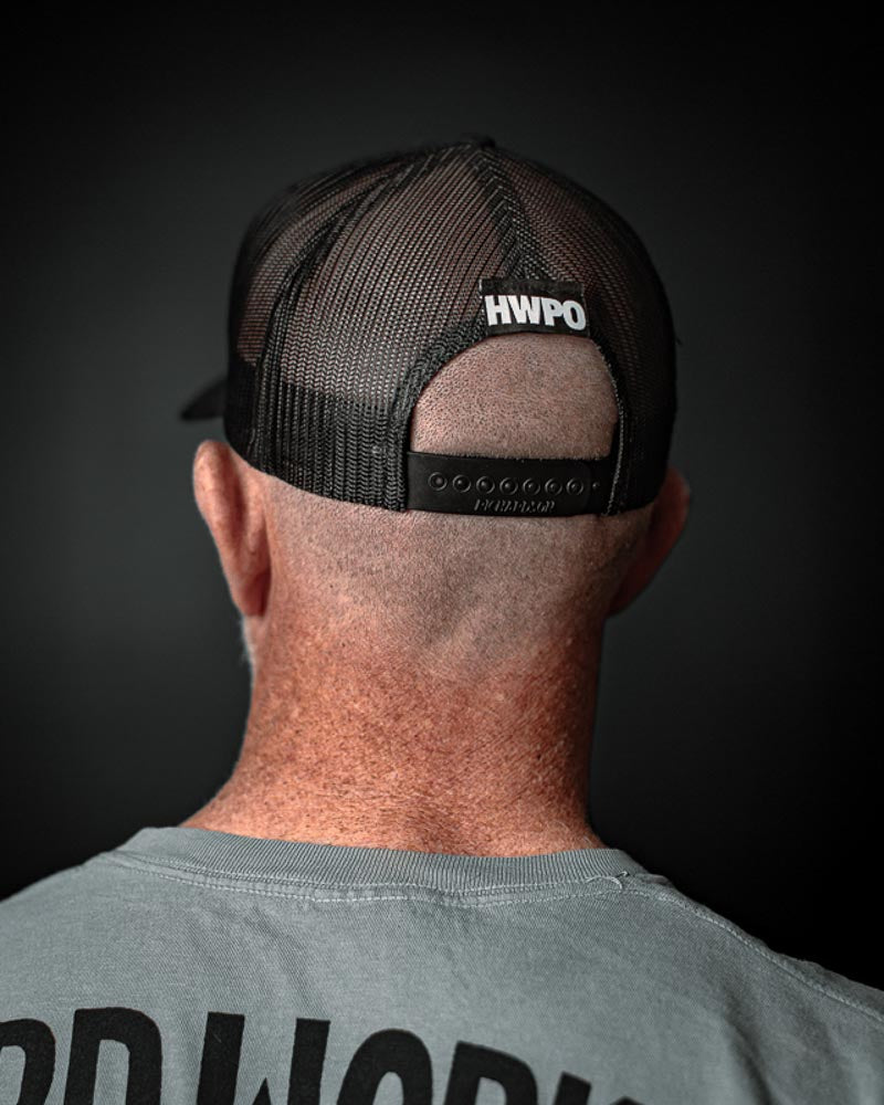 Rear view of Matt O'Keefe wearing the HWPO Trucker Hat