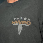 Detailed view of the Legacy Tee badge