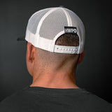 Rear view of HWPO Trucker Hat in Grey on Josh Godinez