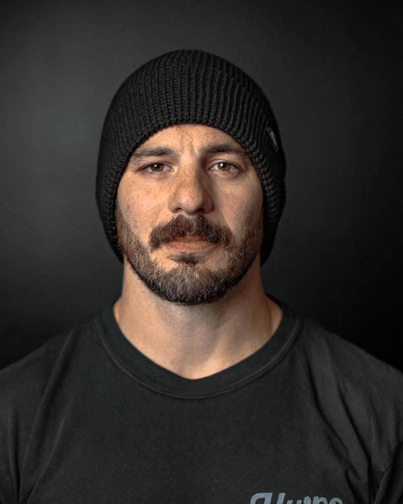 Front view of HWPO Beanie in Black on Mat Fraser
