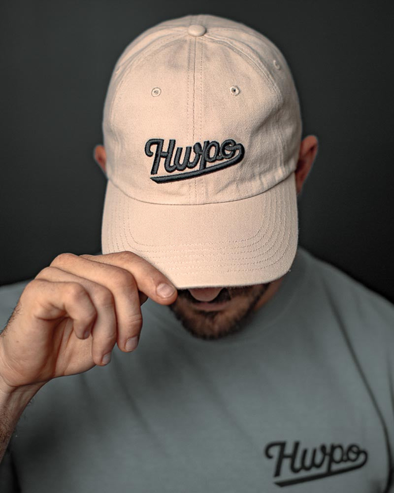 Mat Fraser showing the HWPO Dad hat in Khaki